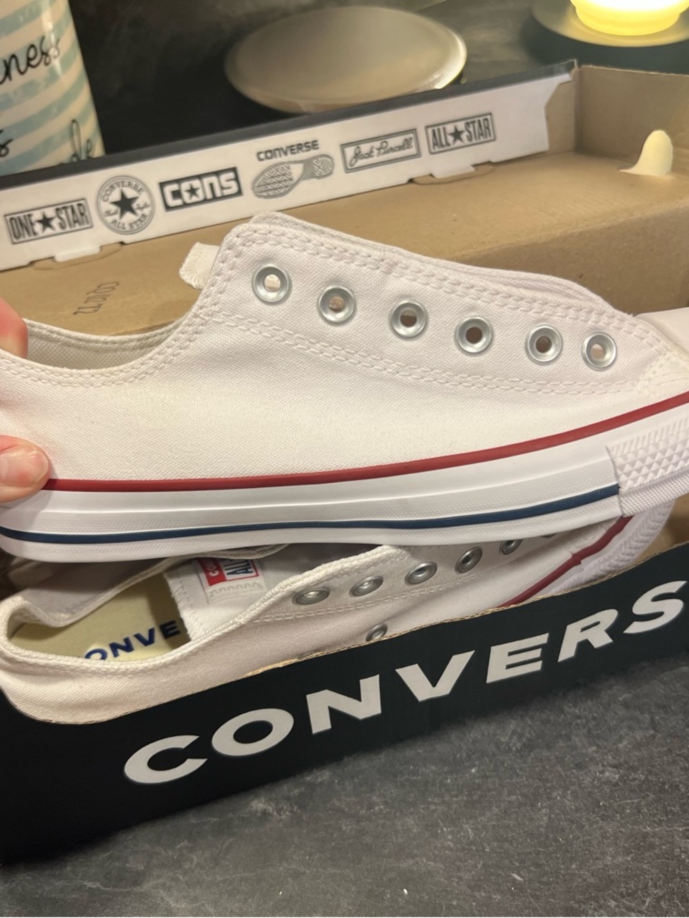 Converse Unisex White Slip-On Canvas Sneakers with Red & Blue Trim